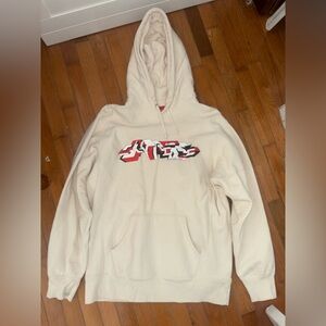 Supreme Cream Hoodie with Red Tag